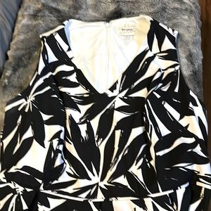 White with black large flowers, wide shoulder straps. Strikingly beautiful fit.